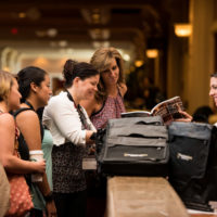 Picking up their bags, credentials, and stuff at registration