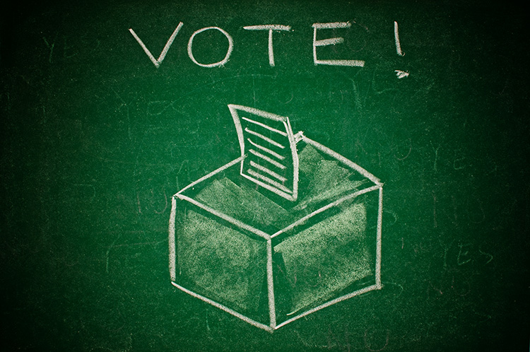 Vote concept; handdrawn ballot box on a green chalkboard